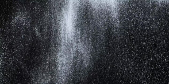 A drop of rain on a black background