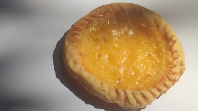 Traditional Balinese pie susu with a sweet creamy milk custard filling, showcasing one of Bali's most popular local snacks.