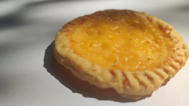Traditional Balinese pie susu with a sweet creamy milk custard filling, showcasing one of Bali's most popular local snacks.