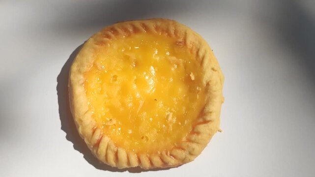 Traditional Balinese pie susu with a sweet creamy milk custard filling, showcasing one of Bali's most popular local snacks.