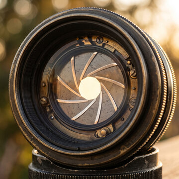 Vintage Camera Lens Aperture Blades Open with Golden Light