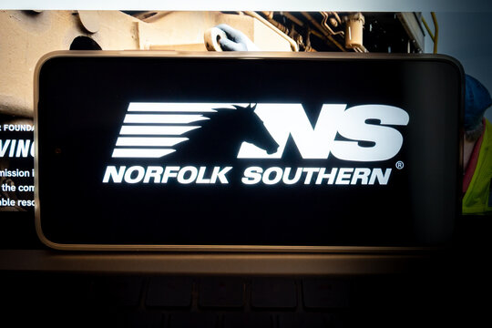 Norfolk southern logo on mobile device during ongoing operations