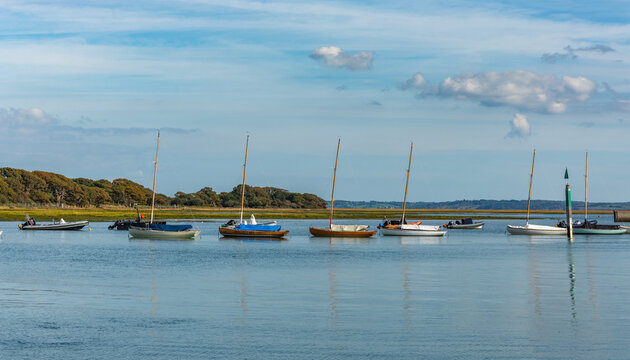 Lymington, UK - September 29th 2025: Sailboats moored in Lymington River.