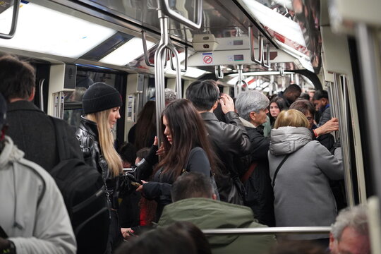 Passengers inside a Paris Metro train