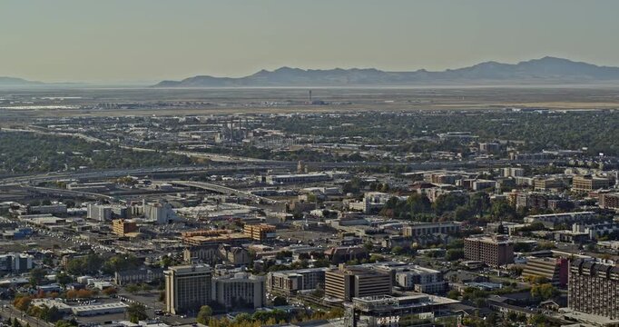Salt Lake City Utah Aerial v17 pan shot overlooking at industrial area and airport, flyover downtown capturing beautiful cityscape with hillside views - Shot with Inspire 2, X7 camera - October 2021