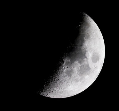 Half of the moon lighted in a dark sky