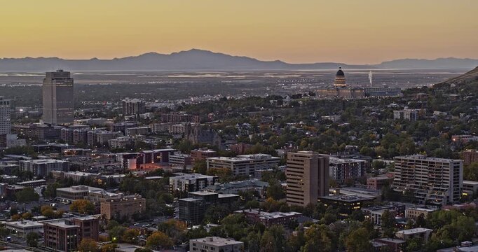 Salt Lake City Utah Aerial v33 panning from state capitol building towards the west capturing downtown cityscape with beautiful golden sunset at dusk - Shot with Inspire 2, X7 camera - October 2021