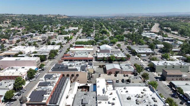 Paso Robles, California, USA - Aerial Pullback Drone View of Downtown City Park Next to US Route 101 Freeway on a Sunny Central Coast Day