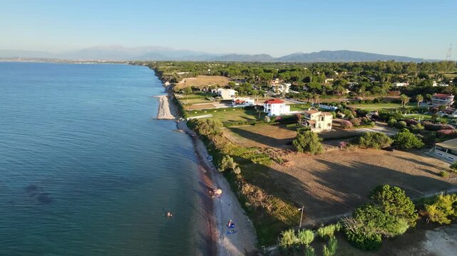 Lakkopetra beach, Patras Greece, the beachfront with calm weather and evening summer light.