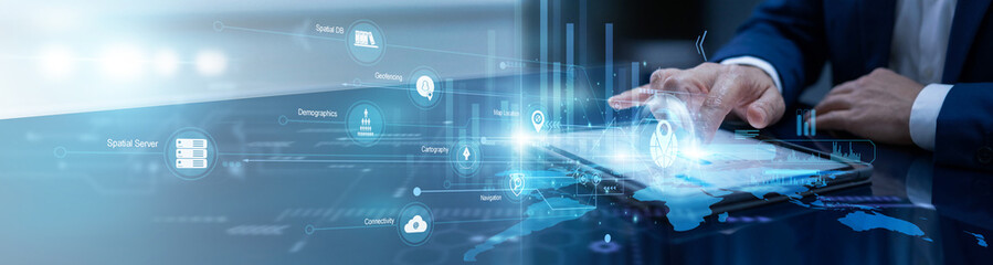 Researcher touches the tablet to utilize GIS technology, mapping complex geographic data and environmental patterns to support urban planning and regional resource management. © FutureLogic Studio