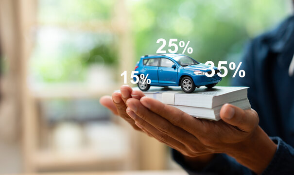 Car on stacks of cash illustrating car financing, auto loan rates, vehicle insurance, down payment, installment planning, automotive investment, personal finance, and financial decision making.