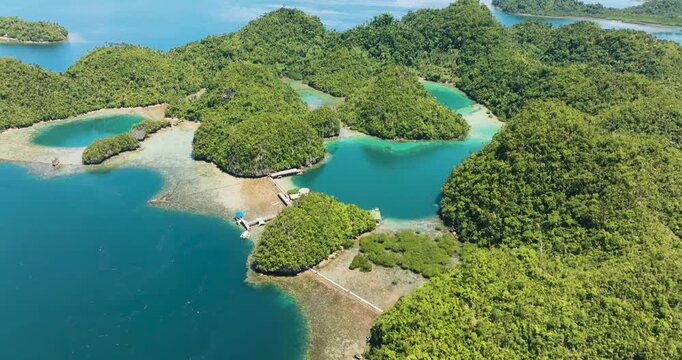 Beautiful blue sea in tropical island with mountain forest. Mindanao, Philippines. Travel concept.