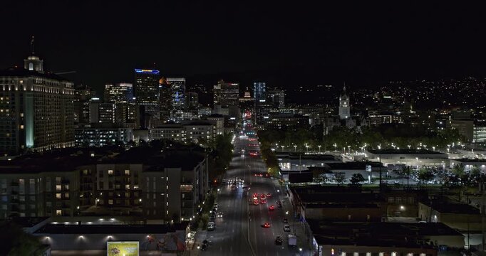Salt Lake City Utah Aerial v37 night downtown cityscape, drone flying above state street capturing illuminated buildings and street at central area - Shot with Inspire 2, X7 camera - October 2021