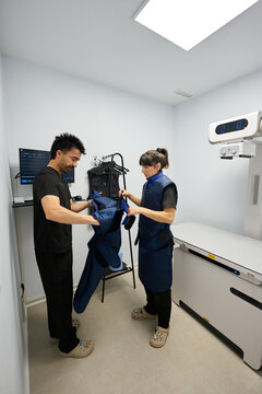 Veterinary professionals preparing for x ray examination