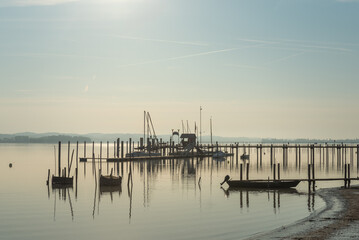 Fototapeta premium Harbor and wooden pier on Lake Constance, Iznang, Hoeri peninsula, Baden-Wuerttemberg, Germany