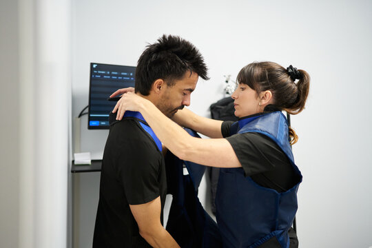 Veterinary technician assisting colleague with radiology