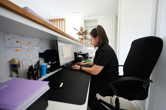 Veterinary receptionist working at clinic front desk