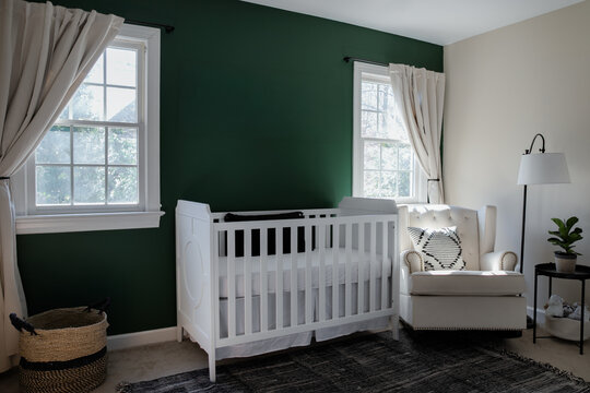 Green Nursery with White Crib and Natural Accents