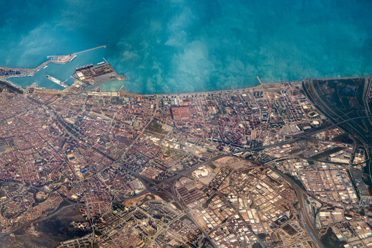 Turquoise sea and town settlement from above