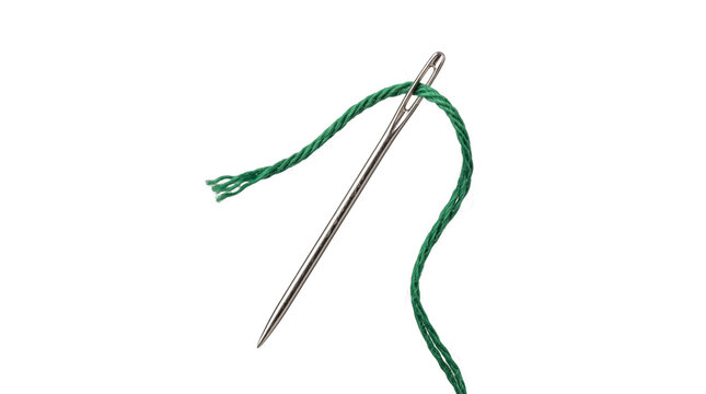 Close up of sewing needle with vibrant green thread, essential tool for tailoring craft.