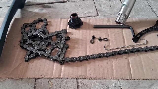 Bicycle repair parts laid out for maintenance motion video footage