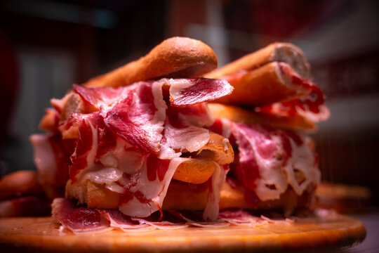 Traditional Spanish Bocadillo de Jamon Iberico with Olive Oil on Crusty Baguette Bread for Tapas Menu