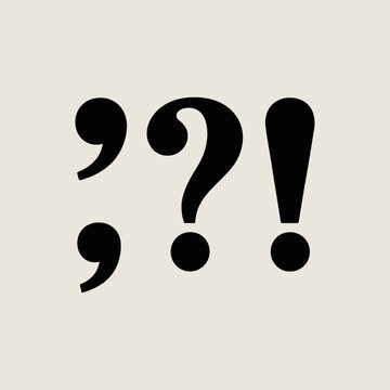 Punctuation marks including a semicolon, a question mark, and an exclamation point displayed in black on a light gray background surface