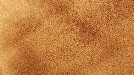 Texture of soft brown suede material, showing detailed velvety structure, perfect for premium leather goods background or textile design. © TOMARILLO