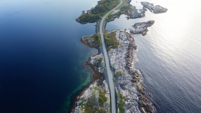 4K aerial view of Norwegian Atlantic Ocean Road. Picturesque union of northern Norway nature landscape and modern highway construction masterpiece. Atlanterhavsvegen, Hustadvika, Norway