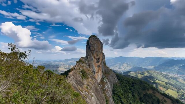Pedra do Ba&uacute; in S&atilde;o Bento do Sapuca&iacute; in aerial view. Rock climbing site. Atlantic Forrest. Time lapse.
