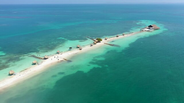 Exotic Tropical Sandbar in the Caribbean Sea. Aerial Drone View of a Narrow Island with Palapas and Turquoise Waters near Cartagena, Colombia