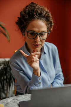 Woman working remotely during a video conference call