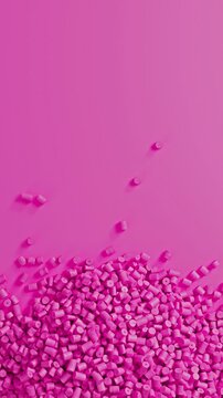 Close-up top view of rotating pink polypropylene plastic granules and masterbatch resin pellet pile, 3D render seamless Vertical video.
