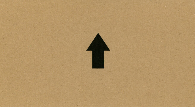 arrow sign on cardboard