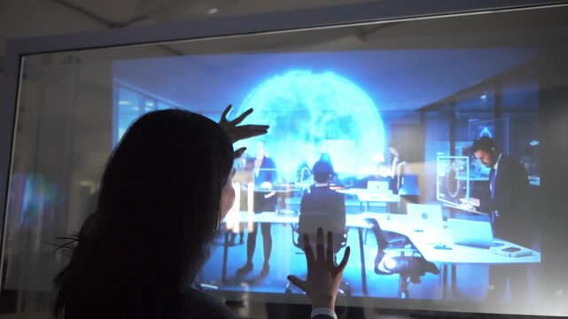 Exploring the holographic globe in a tech workshop in the afternoon
