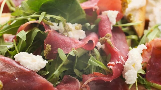 close up of a Cesar salad,  Caesar salad, fresh lettuce, crispy croutons, grated parmesan, creamy dressing, romaine leaves, 