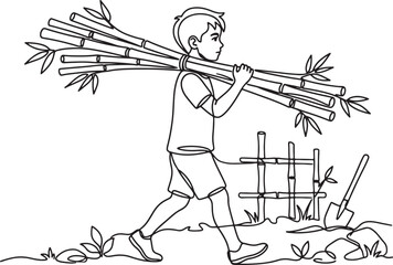 boy carrying bamboo sticks on shoulder near fence