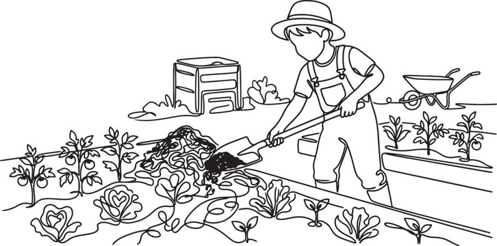 boy gardening in a vegetable garden with shovel and wheelbarrow