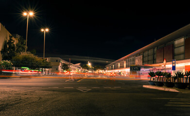 The airport area at night with light trails from moving vehicles and street lamps illuminating the scene, Ibiza, Spain. © Visualis