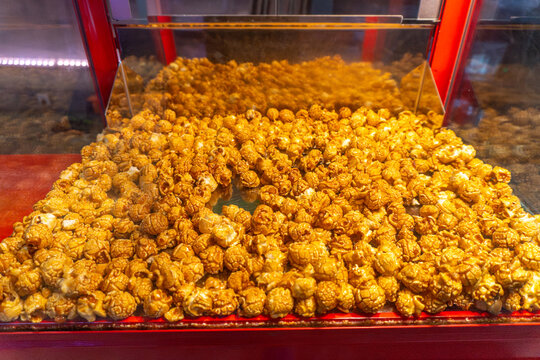 Fresh caramel popcorn in red vending machine display