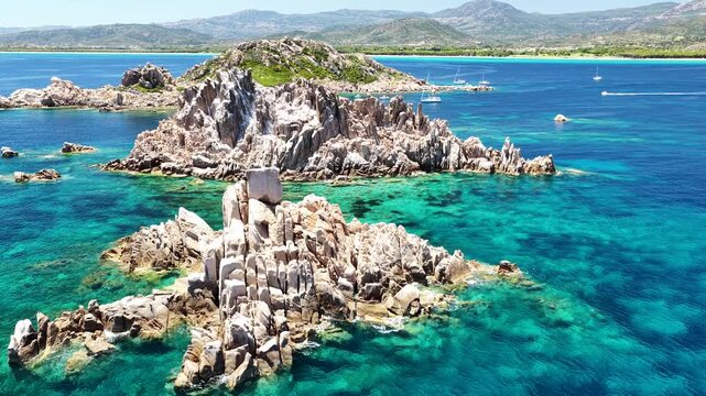 Aerial drone view of Isolotto d'Ogliastra with turquoise sea, Lotzorai, Ogliastra, Sardinia, Italy