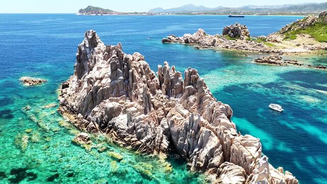 Aerial drone view of Isolotto d'Ogliastra with turquoise sea, Lotzorai, Ogliastra, Sardinia, Italy