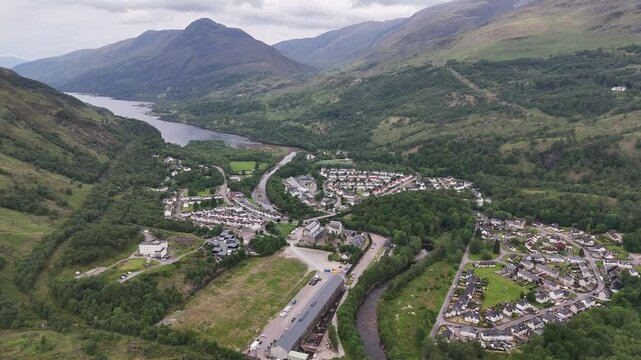 Aerial drone push forward shot of Loch Leven at the village Kinlochleven, part of the West Highland Way in Scotland.