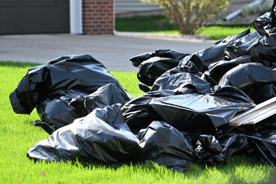 Bags of Trash in the Yard