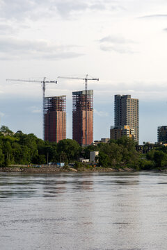 Residential skyscrapers under construction near river