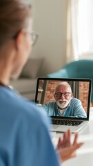 Fototapeta premium Elderly man video chatting on laptop during remote consultation