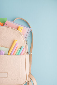 Back to school backpack presenting stationery supplies for students