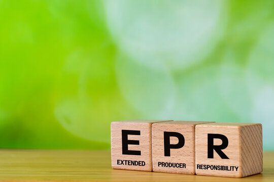 Wooden cubes from symbol EPR symbol and reveals Extended Producer Responsibility. A business-environmental concept. Coverage by companies operating in the EU of recycling and environmental fees.