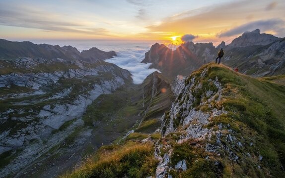 Mountaineer at sunrise at Rotsteinpass, sun star, high fog in the valley, S&auml;ntis, Appenzell Ausserrhoden, Appenzell Alps, Switzerland