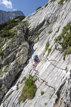 Mountaineer on a climb on a rock face, mountain landscape in the H&ouml;llental, rocky mountain peaks, H&ouml;llental, Bavaria, Germany